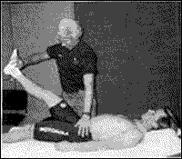 Dr. Maffetone muscle tests cyclist Steve Bauer