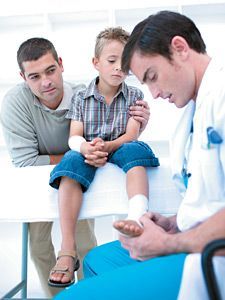 doctor examining feet