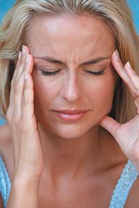 woman with headache - Copyright – Stock Photo / Register Mark